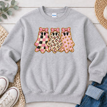 Load image into Gallery viewer, Checkered Leopard Pink Ghosts Halloween design on Ash Grey crewneck sweatshirt