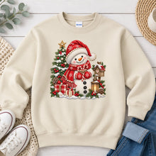 Load image into Gallery viewer, Cozy Snowman Red Scarf Lantern Winter design on Sand crewneck sweatshirt