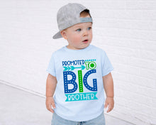 Load image into Gallery viewer, A young child wearing a gray baseball cap and a light blue t-shirt with text that says "PROMOTED TO BIG BROTHER".