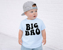 Load image into Gallery viewer, A young child wearing a gray baseball cap and a light blue t-shirt with the text "BIG BRO" printed on it.