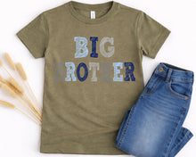 Load image into Gallery viewer, A green t-shirt with the text "BIG BROTHER" printed on it, along with a pair of blue jeans.