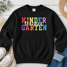 Load image into Gallery viewer, Kindergarten Teacher Rainbow Teacher design on Black crewneck sweatshirt
