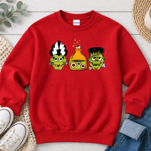 Load image into Gallery viewer, Monster Potion Trio Halloween design on Red crewneck sweatshirt