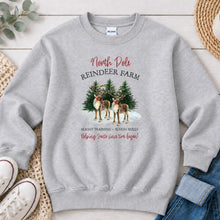 Load image into Gallery viewer, North Pole Reindeer Farm Christmas design on Ash Grey crewneck sweatshirt