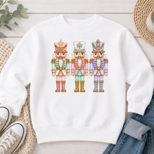 Load image into Gallery viewer, Pastel Nutcrackers Christmas design on White crewneck sweatshirt