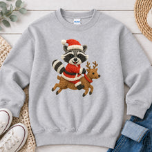 Load image into Gallery viewer, Raccoon Riding Reindeer Christmas design on Ash Grey crewneck sweatshirt