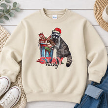 Load image into Gallery viewer, Stay Trashy Raccoon Christmas design on Sand crewneck sweatshirt