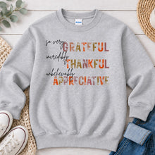 Load image into Gallery viewer, Grateful Thankful Appreciative Thanksgiving design on Ash Grey crewneck sweatshirt