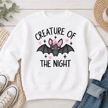 Load image into Gallery viewer, Creature Of The Night Pink Bow Bat Halloween design on White crewneck sweatshirt
