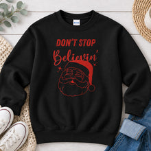 Load image into Gallery viewer, Don't Stop Believin' Santa Christmas design on Black crewneck sweatshirt
