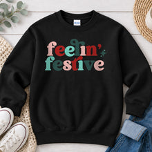 Load image into Gallery viewer, Feelin' Festive Christmas design on Black crewneck sweatshirt
