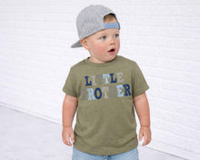 Load image into Gallery viewer, A young child wearing a gray baseball cap and a green t-shirt with the text "LITTLE ROTTER" stands in front of a white brick wall.
