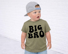 Load image into Gallery viewer, A young child wearing a gray baseball cap and a green t-shirt with the text "BIG BRO" printed on it.
