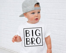Load image into Gallery viewer, A young child wearing a white t-shirt with the text "BIG BRO" printed on it, standing in front of a white brick wall.
