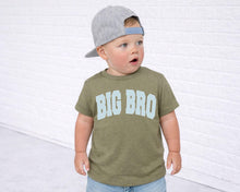 Load image into Gallery viewer, A young child wearing a gray baseball cap and a green t-shirt with the text "BIG BRO" standing in front of a white brick wall.
