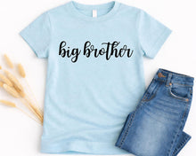 Load image into Gallery viewer, A light blue t-shirt with the text "big brother" printed on it, along with a pair of blue jeans.
