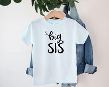 Load image into Gallery viewer, A white t-shirt with the text "big SIS" printed on it, hanging on a clothing hanger.
