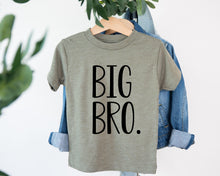 Load image into Gallery viewer, A gray t-shirt with the text "BIG BRO" printed on it, hanging on a clothing hanger.
