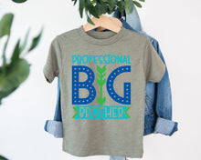 Load image into Gallery viewer, A gray t-shirt with the text "PROFESSIONAL BIG BROTHER" printed on it, along with a graphic design featuring a stylized arrow pointing to the letters "B" and "G".
