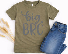 Load image into Gallery viewer, A green t-shirt with the text "BIG BRO" printed on it, along with a pair of blue jeans, are displayed on a white background.
