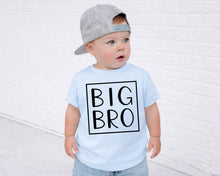 Load image into Gallery viewer, A young child wearing a gray baseball cap and a light blue t-shirt with the text "BIG BRO" printed on it.
