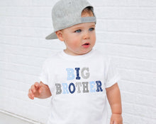 Load image into Gallery viewer, A young child wearing a gray baseball cap and a white t-shirt with the text "BIG BROTHER" printed on it.
