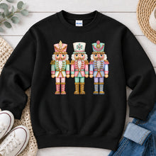 Load image into Gallery viewer, Pastel Nutcrackers Christmas design on Black crewneck sweatshirt
